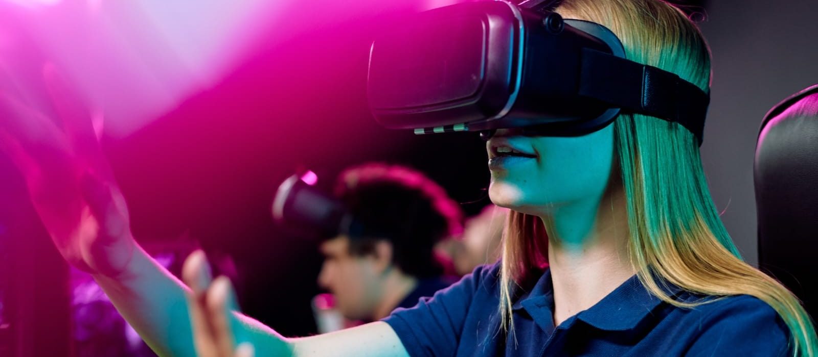 blond-girl-in-vr-goggle-touching-virtual-display-d-2023-11-27-05-25-15-utc blond-girl-in-vr-goggle-touching-virtual-display-d-2023-11-27-05-25-15-utc